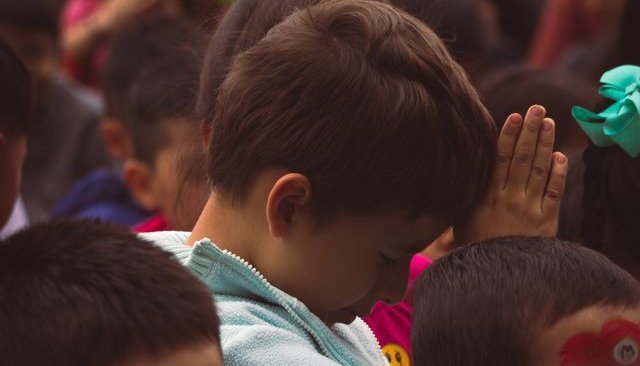 Young kids in school assembly